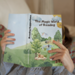 Young child engaged in 'The Magic World of Reading' in a cozy nook with colorful pillows, promoting curiosity and imagination.